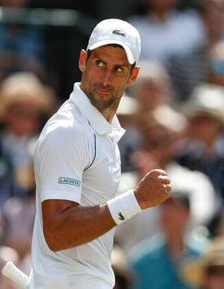 (220710) -- LONDON, July 10, 2022 -- Novak Djokovic of Serbia celebrates scoring during the men s singles final against Nick Kyrgios of Australia at Wimbledon tennis Championship in London, Britain, July 10, 2022. ) (SP) BRITAIN-LONDON-TENNIS-WIMBLEDON-MEN S SINGLES-FINAL HanxYan 