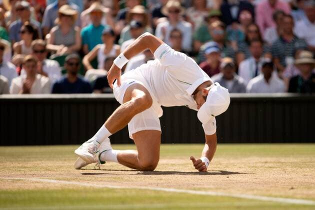 Mandatory Credit: Photo by Ella Ling Shutterstock (13018059ay) Novak Djokovic takes a tumble during the Men s Singles Final Wimbledon Tennis Championships, Day 14, The All England Lawn Tennis and Croquet Club, London, UK - 10 Jul 2022 Wimbledon Tennis Championships, Day 14, The All England Lawn Tennis and Croquet Club, London, UK - 10 Jul 2022  Copyright: xEllaxLing Shutterstockx 13018059ay