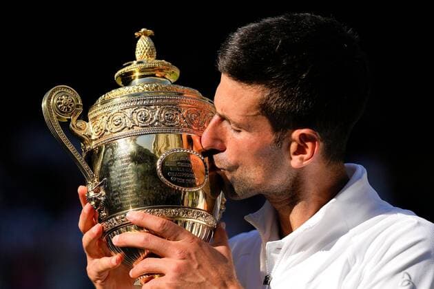 Mandatory Credit: Photo by Dave Shopland Shutterstock (13018058fl) Novak Djokovic kisses the trophy after winning the Men s Singles FInal Wimbledon Tennis Championships, Day 14, The All England Lawn Tennis and Croquet Club, London, UK - 10 Jul 2022 Wimbledon Tennis Championships, Day 14, The All England Lawn Tennis and Croquet Club, London, UK - 10 Jul 2022  Copyright: xDavexShopland Shutterstockx 13018058fl