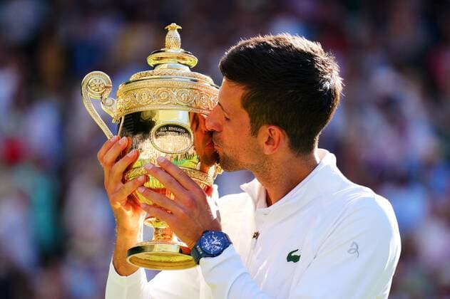 Mandatory Credit: Photo by Javier Garcia Shutterstock (13018062fh) Novak Djokovic kisses the trophy after winning the Men s Singles FInal Wimbledon Tennis Championships, Day 14, The All England Lawn Tennis and Croquet Club, London, UK - 10 Jul 2022 Wimbledon Tennis Championships, Day 14, The All England Lawn Tennis and Croquet Club, London, UK - 10 Jul 2022  Copyright: xJavierxGarcia Shutterstockx 13018062fh