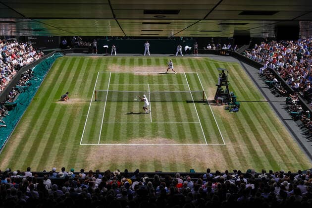10th July 2022, All England Lawn Tennis and Croquet Club, London, England; Wimbledon Tennis tournament, mens singles final; Nick Kyrgios (AUS) plays a backhand to Novak Djokovic (SRB) in front of a packed Centre Court  ActionPlus12407310 JohnxPatrickxFletcher