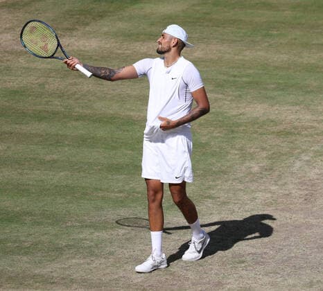 Australian Nick Kyrgios reacts to a call in the Men s Final match against Serbian Novak Djokovic on day fourteen of the 2022 Wimbledon championships in London on Sunday, July 10, 2022. Djokovic won the match 4-6,6-3,6-4,7-6.  LON2022071017 HUGOxPHILPOTT