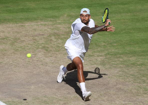 Australian Nick Kyrgios plays a backhand in the Men s Final match against Serbian Novak Djokovic on day fourteen of the 2022 Wimbledon championships in London on Sunday, July 10, 2022. Djokovic won the match 4-6,6-3,6-4,7-6.  LON2022071004 HUGOxPHILPOTT
