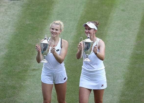 10 July 2022, All England Lawn Tennis and Croquet Club, London, England; Wimbledon Tennis tournament, womens doubles final; Barbora Krejcikova (CZE) and Katerina Siniakova (CZE) pose with the Ladies Doubles Final trophy after defeating Elise Mertens (BEL) and Shuai Zhang (CHN)  ActionPlus12407342 JohnxPatrickxFletcher