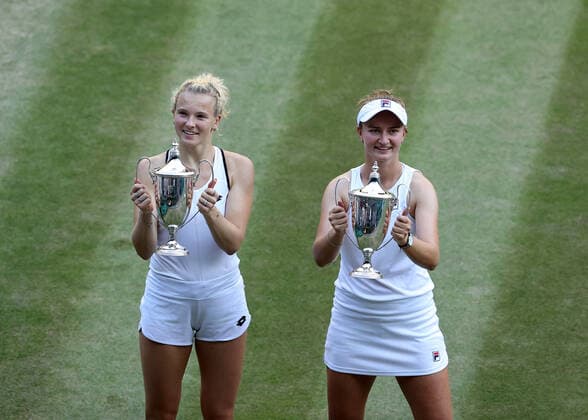 10 July 2022, All England Lawn Tennis and Croquet Club, London, England; Wimbledon Tennis tournament, womens doubles final; Barbora Krejcikova (CZE) and Katerina Siniakova (CZE) pose with the Ladies Doubles Final trophy after defeating Elise Mertens (BEL) and Shuai Zhang (CHN)  ActionPlus12407343 JohnxPatrickxFletcher