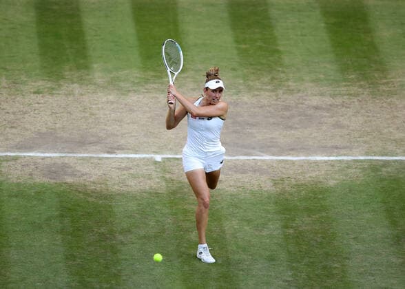 10th July 2022, All England Lawn Tennis and Croquet Club, London, England; Wimbledon Tennis tournament, womens doubles final; Elise Mertens (BEL) plays a backhand to Barbora Krejcikova (CZE)  ActionPlus12407391 JohnxPatrickxFletcher