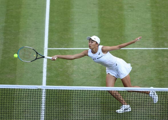 10th July 2022, All England Lawn Tennis and Croquet Club, London, England; Wimbledon Tennis tournament, womens doubles final; Shuai Zhang (CHN) plays a backhand to Barbora Krejcikova (CZE)  ActionPlus12407393 JohnxPatrickxFletcher