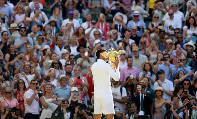 (220711) -- LONDON, July 11, 2022 -- Novak Djokovic celebrates with trophy after winning the men s singles final match between Novak Djokovic of Serbia and Nick Kyrgios of Australia at Wimbledon Tennis Championship in London, Britain, on July 10, 2022. ) (SP)BRITAIN-LONDON-TENNIS-WIMBLEDON-MEN S SINGLES-FINAL LixYing 