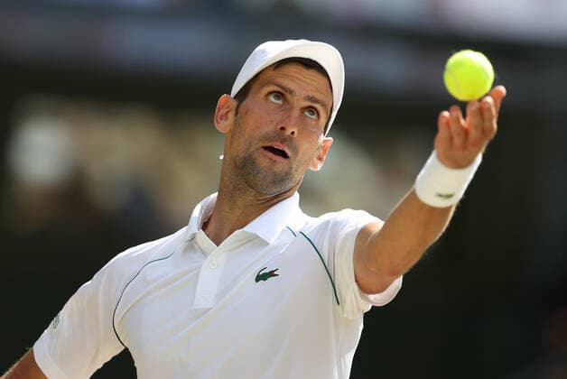 (220711) -- LONDON, July 11, 2022 -- Novak Djokovic competes during the men s singles final match between Novak Djokovic of Serbia and Nick Kyrgios of Australia at Wimbledon Tennis Championship in London, Britain, on July 10, 2022. ) (SP)BRITAIN-LONDON-TENNIS-WIMBLEDON-MEN S SINGLES-FINAL LixYing 