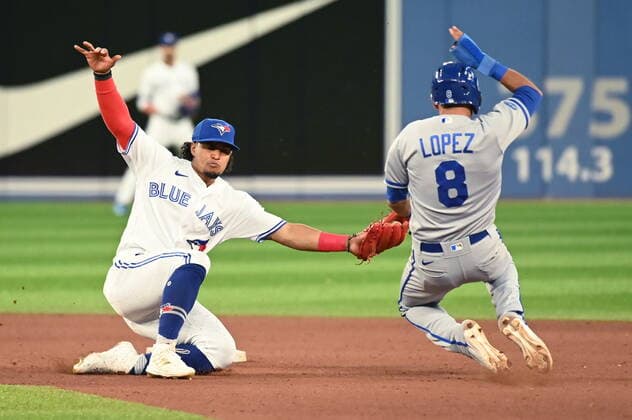 July 14, 2022, Toronto, ON, Canada: Toronto Blue Jays second baseman Santiago Espinal tags out Kansas City Royals second baseman Nicky Lopez at second on an attempted steal batter in the seventh inning of American League baseball action in Toronto, Thursday, July 14, 2022. Santaigo Espinal, Nicky Lopez  - ZUMAc35_ 20220714_zaf_c35_093 Copyright: xJonxBlackerx