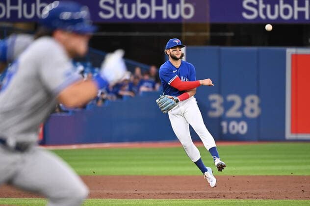 July 15, 2022, Toronto, ON, Canada: Toronto Blue Jays shortstop Bo Bichette, right, throws first base to put out Kansas City Royals Nate Eaton, left, in fifth inning American League baseball action in Toronto, Friday, July 15, 2022. Bo Bichette, Nate Eaton - ZUMAc35_ 20220715_zaf_c35_125 Copyright: xJonxBlackerx