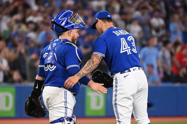 July 15, 2022, Toronto, ON, Canada: Toronto Blue Jays relief pitcher Anthony Banda, left, and catcher Alejandro Kirk celebrate their teams victory over the Kansas City Royals in American League baseball action in Toronto, Friday, July 15, 2022. Anthony Banda, Alejandro Kirk - ZUMAc35_ 20220715_zaf_c35_130 Copyright: xJonxBlackerx
