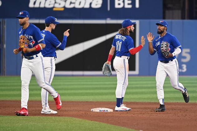 July 15, 2022, Toronto, ON, Canada: Toronto Blue Jays Lourdes Gurriel Jr, left to right, Cavan Biggio, Bo Bichette and Teoscar Hernandez celebrate their team s victory over the Kansas City Royals in American League baseball action in Toronto, Friday, July 15, 2022. Lourdes Gurriel Jr, Cavan Biggio, Bo Bichette, Teoscar Hernandez - ZUMAc35_ 20220715_zaf_c35_131 Copyright: xJonxBlackerx