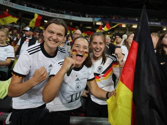 Milton Keynes, England, 27th July 2022. German fans celebrate after the UEFA Women s European Championship, EM, Europameisterschaft 2022 match at stadium:mk, Milton Keynes. Picture credit should read: Paul Terry Sportimage EDITORIAL USE ONLY. No use with unauthorised audio, video, data, fixture lists, club league logos or live services. Online in-match use limited to 120 images, no video emulation. No use in betting, games or single club league player publications. SPI-1770-0046