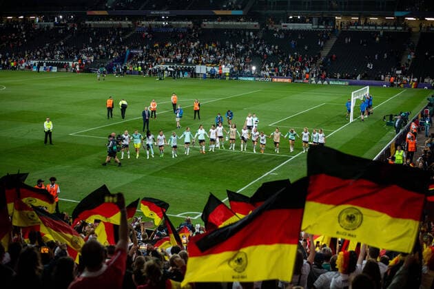 The players of Germany are cheering about the victory, in front of them the fans on the tribune with flags, GBR, Germany vs France, Football UEFA Womens EURO 2022, 27 07 2022, Semi final GBR, Germany vs France, Football UEFA Womens EURO 2022, 27 07 2022, Semi final Milton Keynes Copyright: xEibner Memmlerx EP_MMR