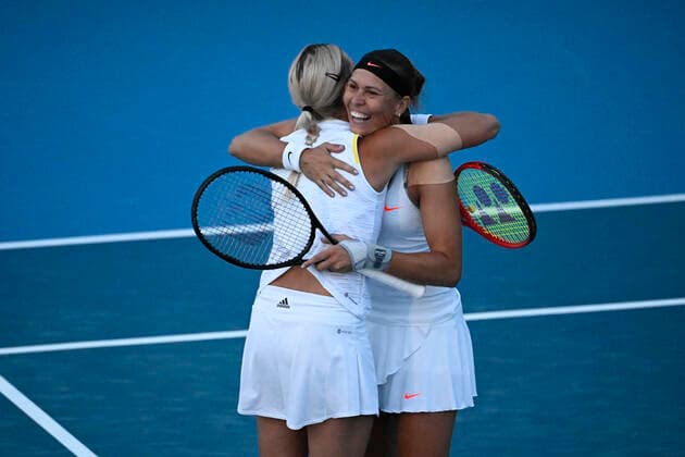 Czech tennis players Lucie Hradecka, righ, and Andrea Sestini Hlavackova, left, hug during the Livesport Prague Open WTA, Tennis Damen women’s tennis tournament, doubles, quarterfinal, against Miyu Kato and Samantha Murray, the last match in Hlavackova s professional career, on July 28, 2022, in Prague, Czech Republic. (CTKxPhoto OndrejxDeml) CTKPhotoP2022072808368