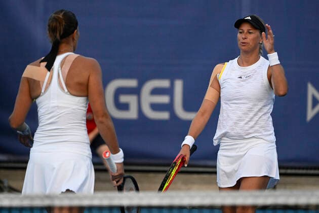 Czech tennis players Lucie Hradecka, left, and Andrea Sestini Hlavackova, right, are seen during the Livesport Prague Open WTA, Tennis Damen women’s tennis tournament, doubles, quarterfinal, against Miyu Kato and Samantha Murray, the last match in Hlavackova s professional career, on July 28, 2022, in Prague, Czech Republic. (CTKxPhoto OndrejxDeml) CTKPhotoP2022072808371