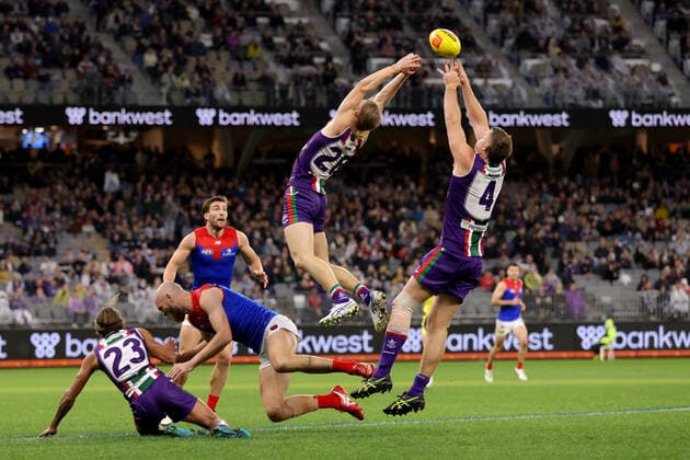 AFL DOCKERS DEMONS, Hayden Young and Sean Darcy of the Dockers try to mark the ball during the AFL Round 20 match between the Fremantle Dockers and the Melbourne Demons at Optus Stadium in Perth, Friday, July 29, 2022. ( NO ARCHIVING, EDITORIAL USE ONLY, NO USE IN BOOKS WITHOUT CONSENT PERTH WESTERN AUSTRALIA AUSTRALIA  Copyright: xRICHARDxWAINWRIGHTx 20220729001684369806