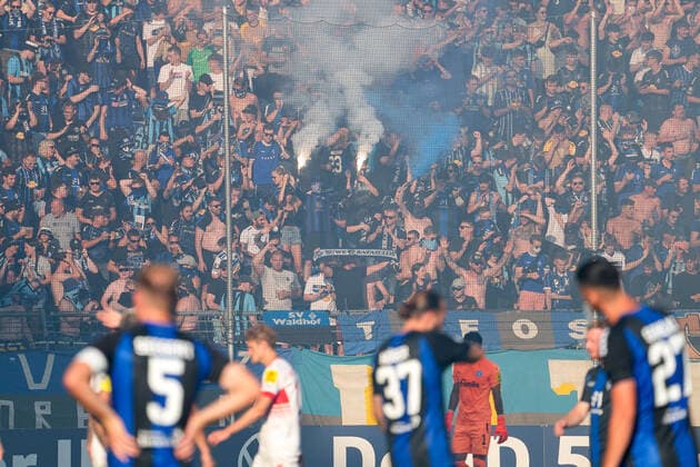 The fans of SV Waldhof Mannheim ignite pyrotechnics in the fan curve, immerse the stadium thereby in fog, fog the Otto Siffling grandstand, and provide for a short interruption of the game, mood in the stadium, atmosphere, pyro, pyros, Ultras, spectators, fan block, chaotic, Bengalo, Bengalos, fireworks, flare, symbol photo, symbol picture, symbol, 31 07 2022, Mannheim Germany , football, DFB Pokal, 1 round, SV Waldhof Mannheim KSV Holstein Kiel, DFB DFL REGULATES PROHIBIT ANY USE OF PHOTOGRAPHS AS IMAGE SEQUENCES AND OR QUASI VIDEO xozx