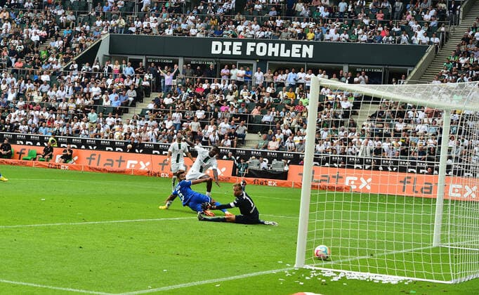06 08 2022 Moenchengladbach football, men, 1 football Bundesliga, season 2022 2023, Borussia Moenchengladbach vs TSG 1899 Hoffenheim goal to 2 1 Marcus Thuram Gladbach, center back pulls off and scores to 2 1 against goalkeeper Oliver Baumann Hoffenheim, re Ozan Kabak Hoffenheim, center forward comes too late DFL regulations prohibit any use of photographs as image sequences and or quasi video Borussia Park NRW Germany