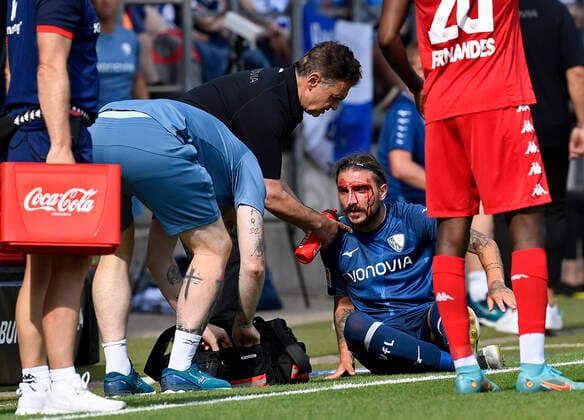 06 08 2022, Bochum, Germany, Vonovia Ruhrstadion, VfL Bochum vs 1 FSV Mainz 05 1 Bundesliga, Konstantinos Stafylidis VfL Bochum injured photo Ralf Treese DFB DFL REGULATIONS PROHIBIT ANY USE OF PHOTOGRAPHS AS IMAGE SEQUENCES AND OR QUASI VIDEO Bochum Vonovia Ruhrstadion North Rhine Westphalia Germany  521_BOCM0520220806_031 Treese-521
