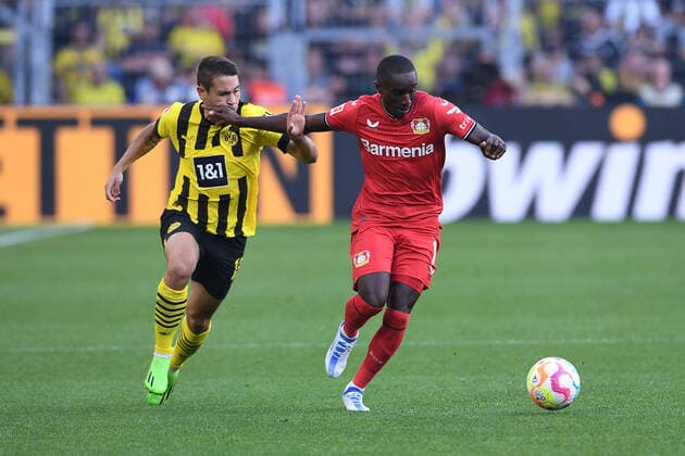 Soccer 1 Bundesliga 1 Matchday Borussia Dortmund Bayer 04 Leverkusen on 06 08 2022 at Signal Iduna Park in Dortmund Raphael Guerreiro Dortmund , left Moussa Diaby Leverkusen , right DFL regulations prohibit any use of photographs as image sequences and or quasi video xHDx