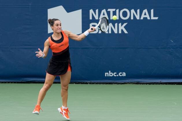 TORONTO, ON - AUGUST 08: Martina Trevisan returns the ball during her National Bank Open tennis tournament first round match on August 8, 2022, at Sobeys Stadium in Toronto, ON, Canada. (Photo by Julian Avram Icon Sportswire via Getty Images) TENNIS: AUG 08 National Bank Open Icon2208080432