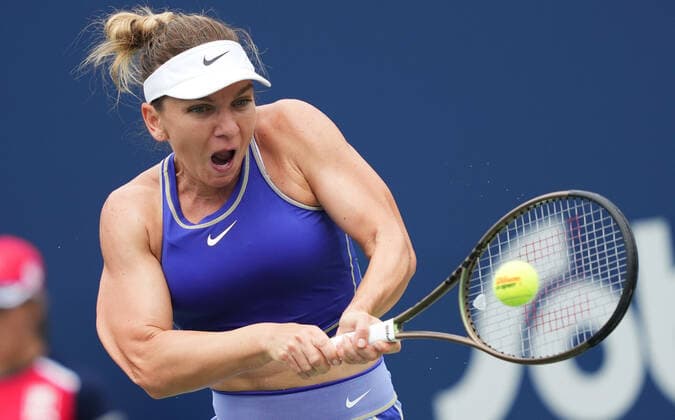 (220809) -- TORONTO, Aug. 9, 2022 -- Simona Halep of Romania returns the ball during the first round of women s singles match between Donna Vekic of Croatia and Simona Halep of Romania at the 2022 National Bank Open in Toronto, Canada, on Aug. 8, 2022. (Photo by Xinhua) (SP)CANADA-TORONTO-TENNIS-NATIONAL BANK OPEN-WOMEN S SINGLES ZouxZheng 