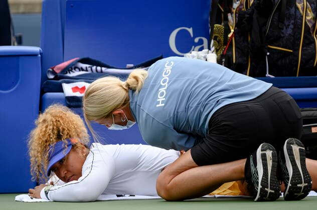 August 9, 2022, Toronto, ON, Canada: Naomi Osaka is tended to by a trainer during a match against Kaia Kanepi of Estonia, during the National Bank Open tennis tournament in Toronto, on Tuesday, Aug. 9, 2022. Canada News - August 9, 2022  - ZUMAc35_ 20220809_zaf_c35_121 Copyright: xChristopherxKatsarovx
