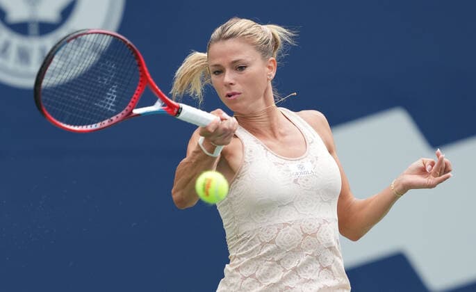 (220810) -- TORONTO, Aug. 10, 2022 -- Camila Giorgi of Italy returns the ball during the first round of women s singles match between Emma Raducanu of Britain and Camila Giorgi of Italy at the 2022 National Bank Open tennis tournament in Toronto, Canada, on Aug. 9, 2022. (Photo by Zou Zheng Xinhua) (SP)CANADA-TORONTO-TENNIS-NATIONAL BANK OPEN-WOMEN S SINGLES linwei2 