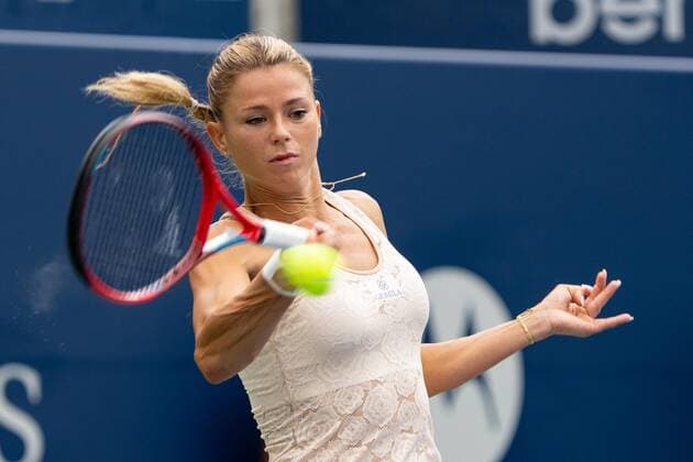 TORONTO, ON - AUGUST 09: Camila Giorgi returns the ball during her National Bank Open tennis tournament first round match on August 9, 2022, at Sobeys Stadium in Toronto, ON, Canada. (Photo by Julian Avram Icon Sportswire) TENNIS: AUG 09 National Bank Open Icon22080921822