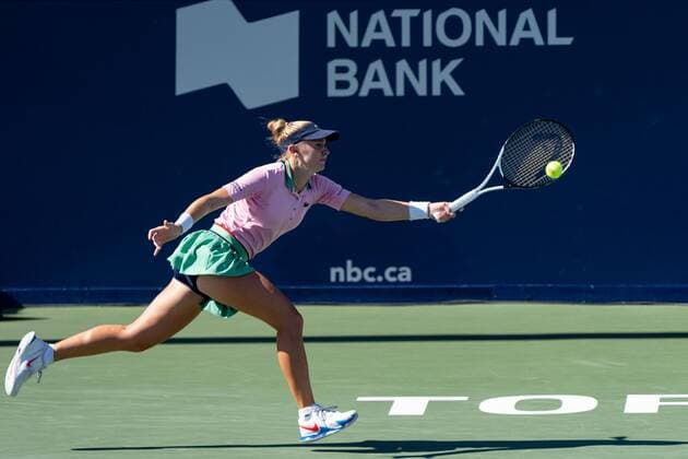 TORONTO, ON - AUGUST 10: Jil Teichmann returns the ball during her National Bank Open tennis tournament second round match on August 10, 2022, at Sobeys Stadium in Toronto, ON, Canada. (Photo by Julian Avram Icon Sportswire) TENNIS: AUG 10 National Bank Open Icon2208103537
