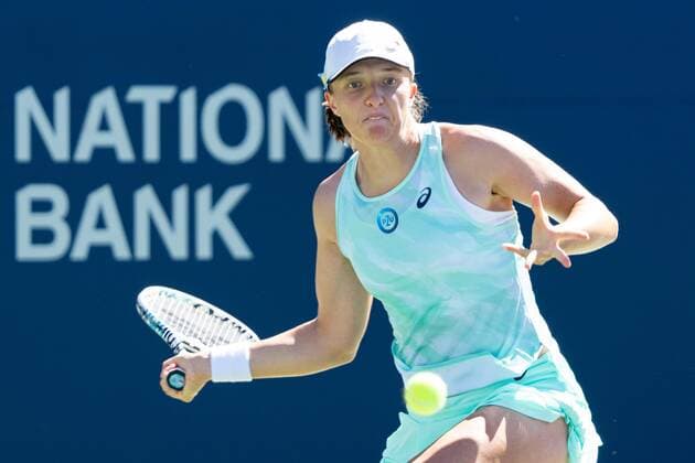 TORONTO, ON - AUGUST 11: Iga Swiatek returns the ball during her National Bank Open tennis tournament third round match on August 11, 2022, at Sobeys Stadium in Toronto, ON, Canada. (Photo by Julian Avram Icon Sportswire) TENNIS: AUG 11 National Bank Open Icon2208112067