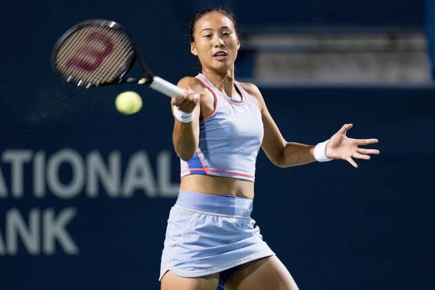 TORONTO, ON - AUGUST 11: Qinwen Zheng returns the ball during her National Bank Open tennis tournament third round match on August 11, 2022, at Sobeys Stadium in Toronto, ON, Canada. (Photo by Julian Avram Icon Sportswire) TENNIS: AUG 11 National Bank Open Icon2208112750