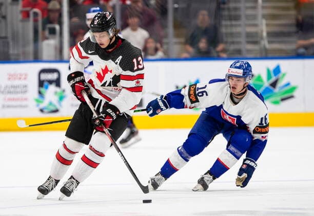 August 11, 2022, EDMONTON, AB, CANADA: Canada s Kent Johnson (13) and Slovakia s Oliver Stumpel (16) battle for the puck during first period IIHF World Junior Hockey Championship action in Edmonton on Thursday August 11, 2022. Canada News - August 11, 2022  - ZUMAc35_ 20220811_zaf_c35_208 Copyright: xJasonxFransonx