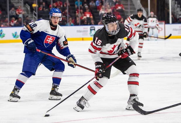 August 11, 2022, EDMONTON, AB, CANADA: Canada s Connor Bedard (16) is chased by Slovakia s Servac Petrovsky (18) during second period IIHF World Junior Hockey Championship action in Edmonton on Thursday August 11, 2022. Canada News - August 11, 2022  - ZUMAc35_ 20220811_zaf_c35_232 Copyright: xJasonxFransonx