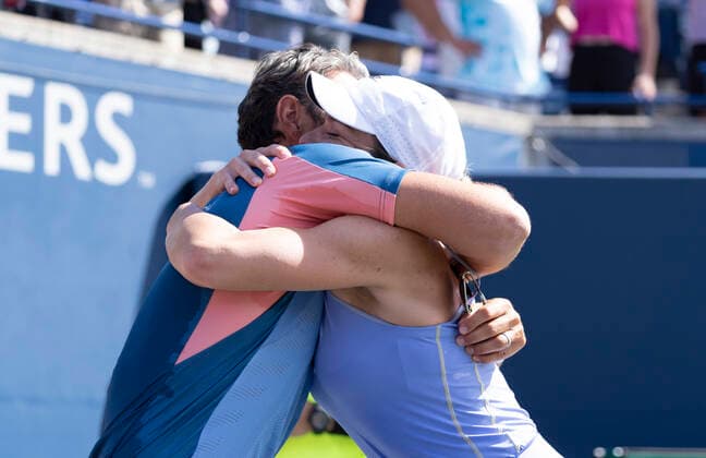 August 14, 2022, Toronto, Ontario, Canada: Coach PATRICK MOURATOGLOU hugs SIMONA HALEP after she defeated Beatriz Haddad Maia 3-6, 6-2, 3-6 to win the National Bank Open in Toronto Canada. Toronto Canada - ZUMAm215 20220814_zip_m215_009 Copyright: xArlynxMcAdoreyx