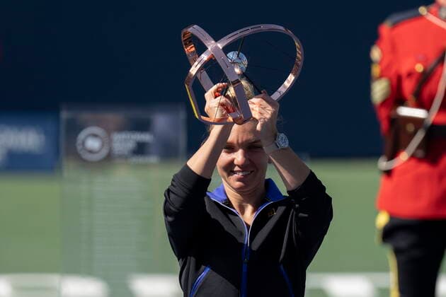 August 14, 2022, TORONTO, ON, CAN: Simona Halep, of Romania, holds the trophy after beating BrazilöÄÃ s Beatriz Haddad Maia in the final of the National Bank Open tennis tournament in Toronto on Sunday, August 14, 2022. Simona Halep  - ZUMAc35_ 20220814_zaf_c35_090 Copyright: xChrisxYoungx