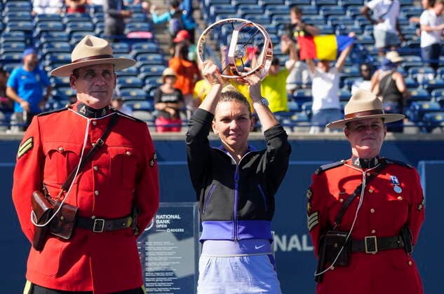 August 14, 2022, TORONTO, ON, CANADA: Simona Halep, of Romania, hoists the trophy after defeating Beatriz Haddad Maia, of Brazil, to win the National Bank Open finals tennis tournament in Toronto on Sunday, August 14, 2022. Canada News - August 14, 2022  - ZUMAc35_ 20220814_zaf_c35_102 Copyright: xNathanxDenettex