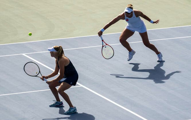 (220815) -- TORONTO, Aug. 15, 2022 -- Nicole Melichar-Martinez (R) of the United States Ellen Perez of Australia compete during the women s doubles final against Coco Gauff Jessica Pegula of the United States at the 2022 National Bank Open tennis tournament in Toronto, Canada, Aug. 14, 2022. (Photo by Xinhua) (SP)CANADA-TORONTO-TENNIS-NATIONAL BANK OPEN-WOMEN S DOUBLES FINAL ZouxZheng 