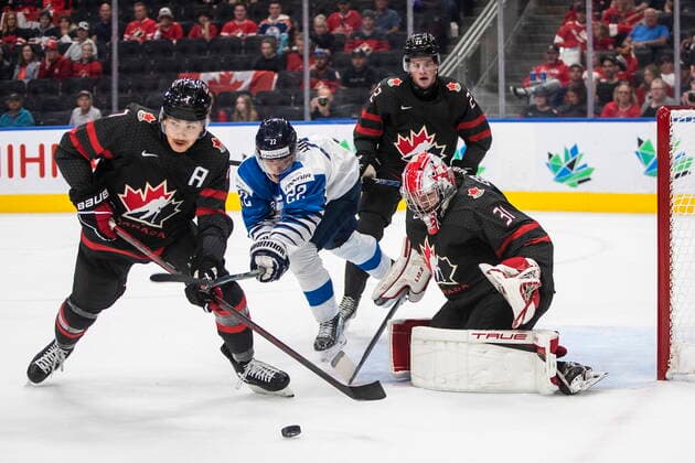 August 15, 2022, EDMONTON, AB, CANADA: Canada goalie Dylan Garand (31) makes the save as Donovan Sebrango (7) and Finland s Roni Hirvonen (22) battle for the rebound during first period IIHF World Junior Hockey Championship action in Edmonton on Monday August 15, 2022. Canada News - August 15, 2022  - ZUMAc35_ 20220815_zaf_c35_053 Copyright: xJasonxFransonx
