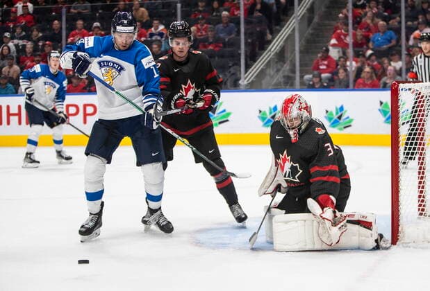 August 15, 2022, EDMONTON, AB, CANADA: Canada goalie Dylan Garand (31) makes the save as Finland s Joel Maatta (18) and Roni Hirvonen (22) battle for the rebound during third period IIHF World Junior Hockey Championship action in Edmonton on Monday August 15, 2022. Canada News - August 15, 2022  - ZUMAc35_ 20220815_zaf_c35_091 Copyright: xJasonxFransonx