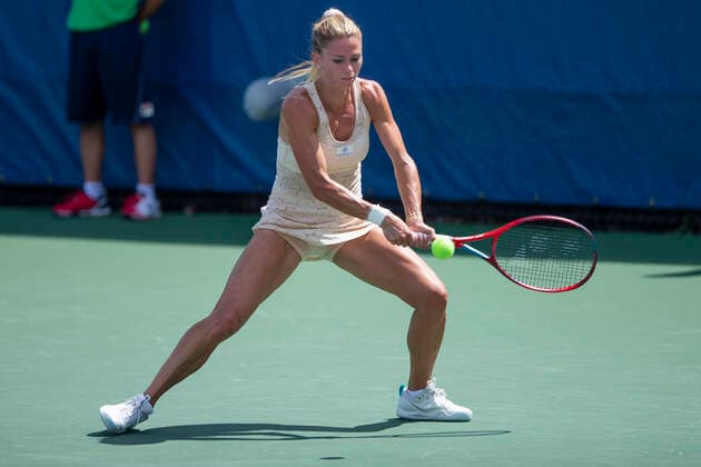 September 15, 2022, Mason, OH, USA: Western and Southern Open Tennis, Mason, OH - Camilla Giorgi plays the ball against opponent Marta Kortyuk. August 16, 2022 - ZUMA Press Mason USA - ZUMAn24_ 20220915_zaf_n24_035 Copyright: xWallyxNellx