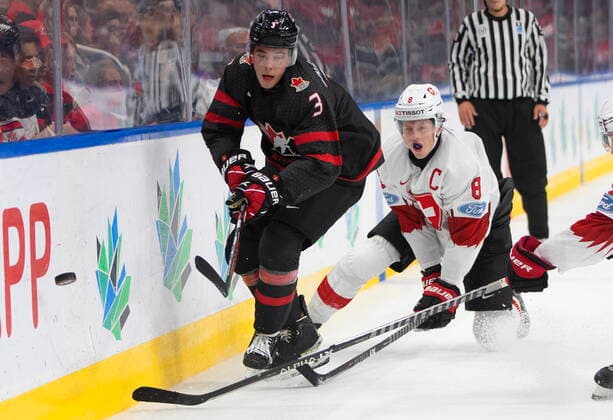 August 17, 2022, EDMONTON, AB, CANADA: Canada s Olen Zellweger (3) and Switzerland s Simon Knak (8) battle for the puck during second period IIHF World Junior Hockey Championship quarterfinal action in Edmonton on Wednesday August 17, 2022. Canada News - August 17, 2022  - ZUMAc35_ 20220817_zaf_c35_117 Copyright: xJasonxFransonx