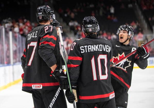 August 17, 2022, EDMONTON, AB, CANADA: Canada s Will Cuylle (27), Logan Stankoven (10) and Donovan Sebrango (7) celebrate a goal against Switzerland during second period IIHF World Junior Hockey Championship quarterfinal action in Edmonton on Wednesday August 17, 2022. Canada News - August 17, 2022  - ZUMAc35_ 20220817_zaf_c35_116 Copyright: xJasonxFransonx