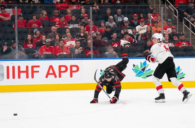 August 17, 2022, Edmonton, Alberta, Canada: GIANCARLO CHANTON (5) of Switzerland body checks JACK THOMPSON (22) of Canada during the first period of a 2022 IIHF World Junior Championship quarter-final playoff match at Rogers Place in Edmonton, Alberta. Edmonton Canada - ZUMAh176 20220817_zsp_h176_083 Copyright: xMatthewxHelfrichx