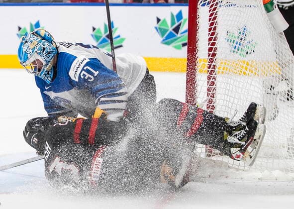 August 20, 2022, EDMONTON, AB, CANADA: Canada s Mason McTavish (23) crashes into Finland s goalie Juha Jatkola (31) during second period IIHF World Junior Hockey Championship gold medal game action in Edmonton on Saturday August 20, 2022. Canada News - August 20, 2022  - ZUMAc35_ 20220820_zaf_c35_082 Copyright: xJasonxFransonx