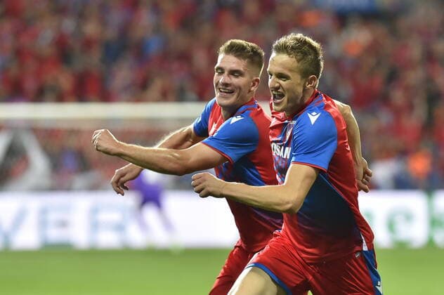 From left soccer players of Viktoria Plzen Libor Holik, Jan Kopic celebrate goal during the return match of football Champions League qualifier fourth round Viktoria Plzen vs FK Qarabag in Pilsen, Czech Republic, August 23, 2022. (CTKxPhoto MiroslavxChaloupka) CTKPhotoP2022082307649 
