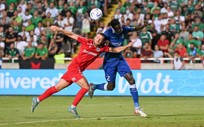Omonia s Adam Matthews and Gent s Joseph Okumu fight for the ball during a soccer game between Cypriot Omonia Nicosia and Belgian KAA Gent in Nicosia, Cyprus on Thursday 25 August 2022, the return leg of the play-offs for the UEFA Europa League competition. DAVIDxCATRY  x40928629x