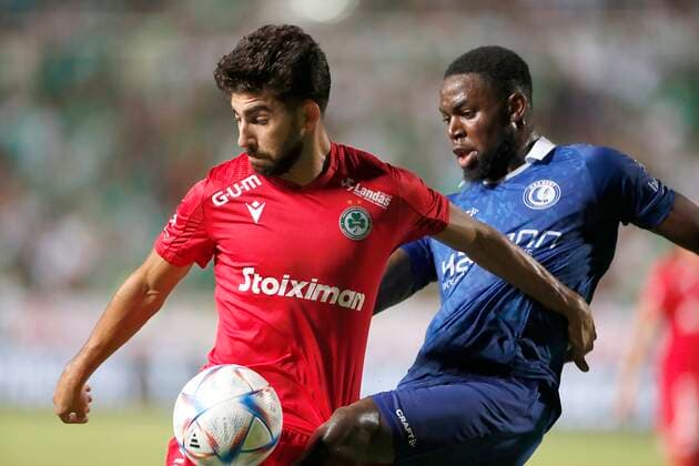 NICOSIA, CYPRUS - AUGUST 25 : Kakoulli Andronikos forward of Omonia and Torunarigha Jordan defender of KAA Gent during the UEFA Europa Conference league Fourth Qualifying Round match second leg between Omonia Nicosia and Kaa Gent on august 25, 2022 in Nicosia, Cyprus, 25 08 2022 ( Omonia Nicosia v Kaa Gent - Conference League PhotoNews Panoramic 
